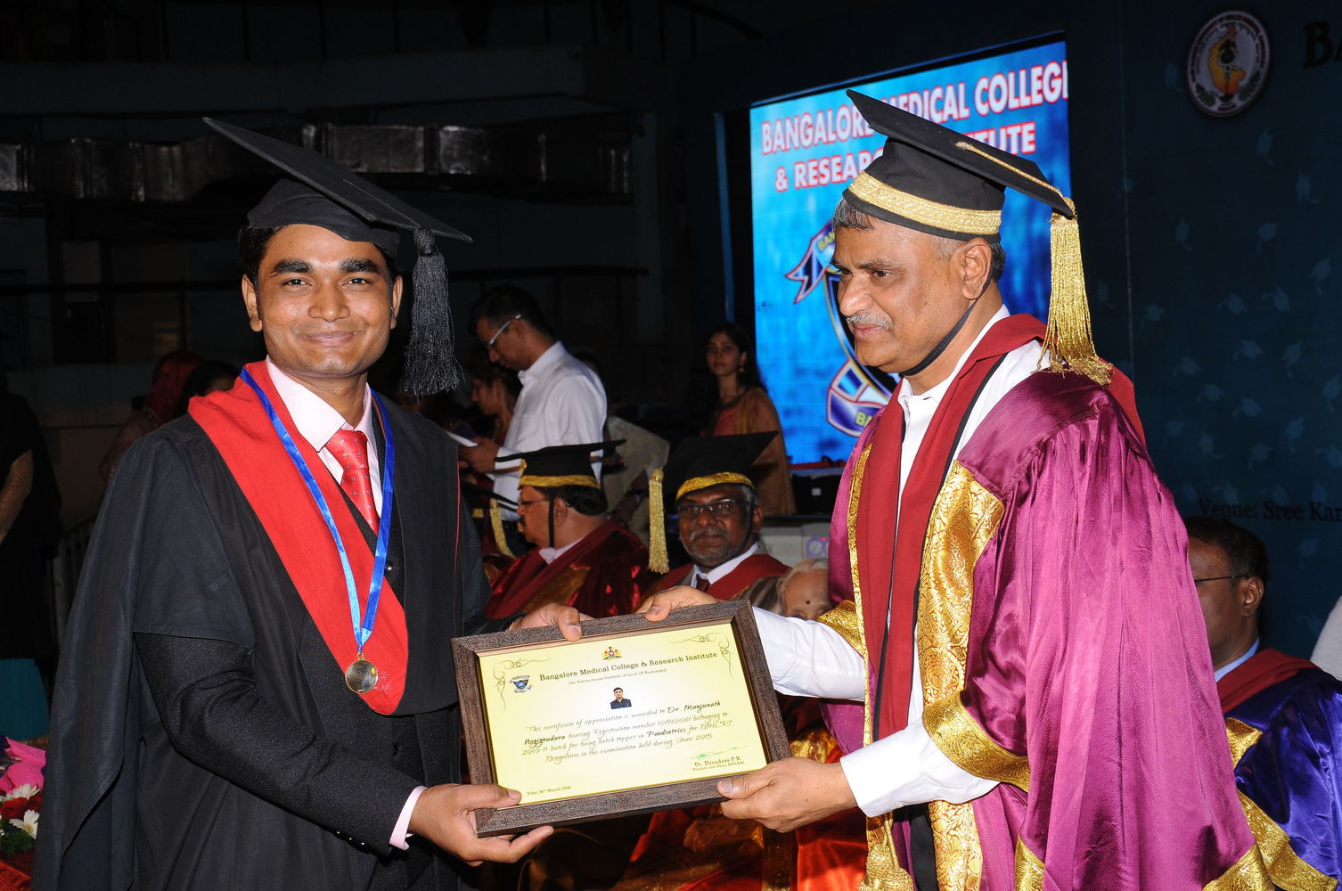 Dr Manjunath M N receiving the MBBS Gold Medal at Bangalore Medical College